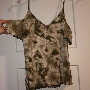 green and white shirt with shoulder cutouts